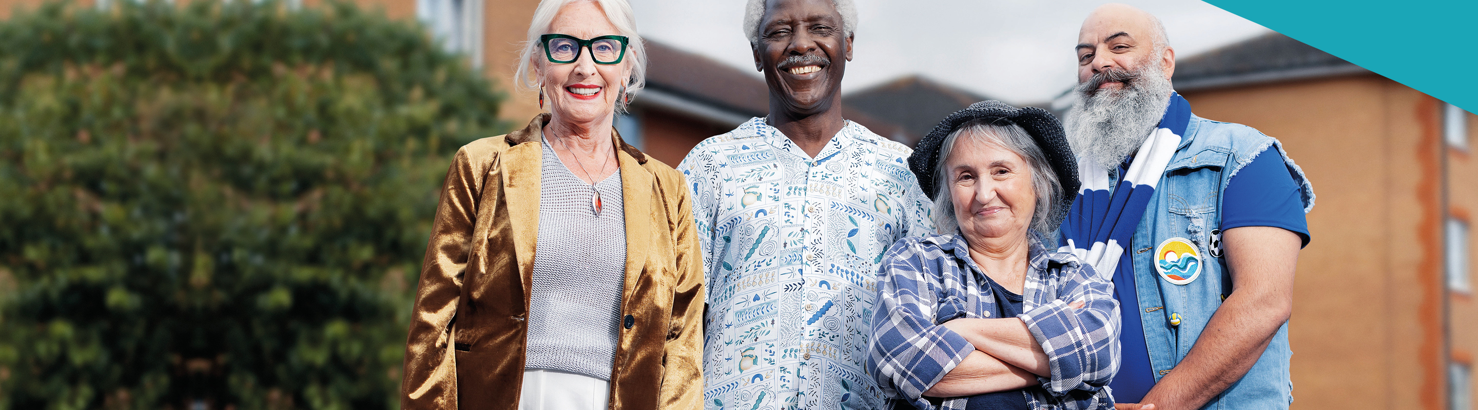 four individuals smiling